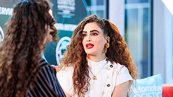Saba Azizi, Head of Service Network and Business Development, aftersales EMEA, CATL and Emily Uwemedimo, Automotive Logistics, on the red sofa at ALSC Europe 2026.