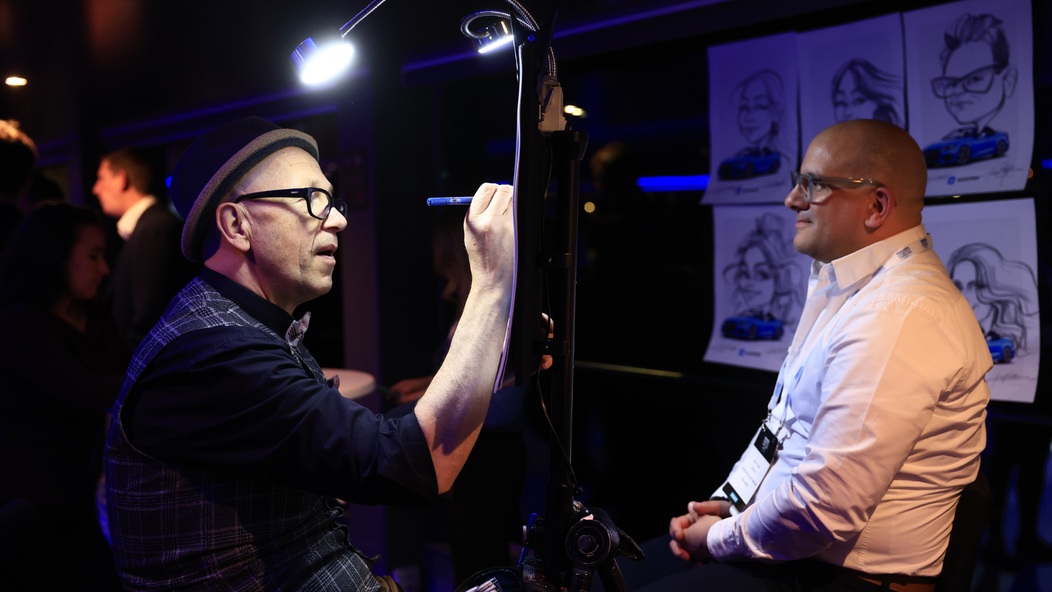 Caricaturist live drawing delegate at networking dinner, ALSC Europe 2026.